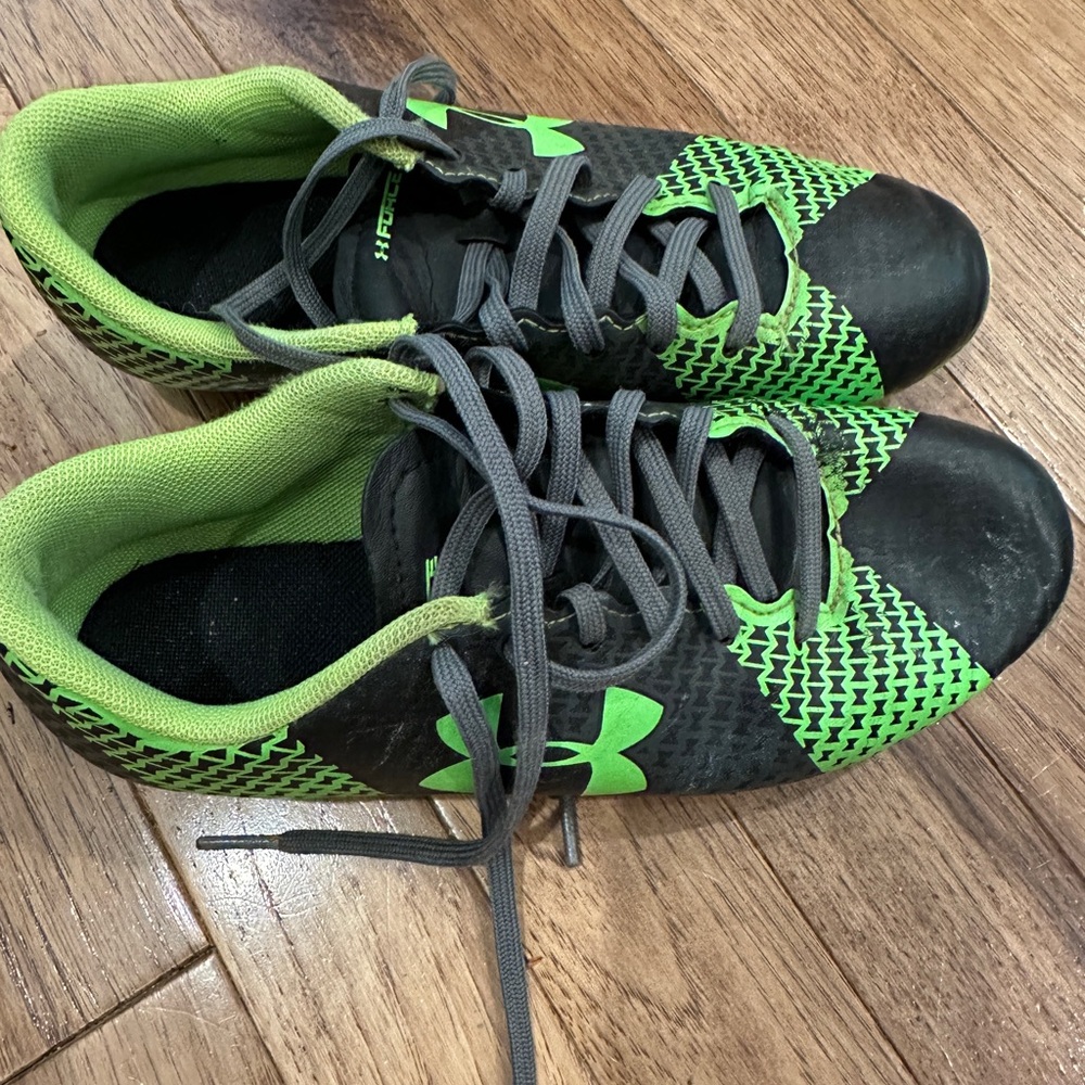 Under Amour youth soccer cleats. Green and black. Size 2Y.